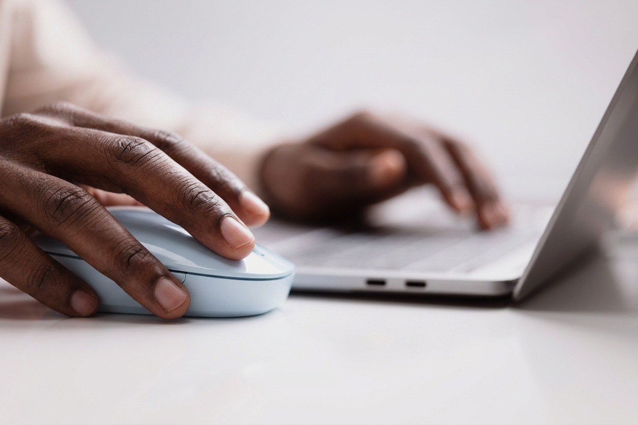 Closeup of someone using a computer.