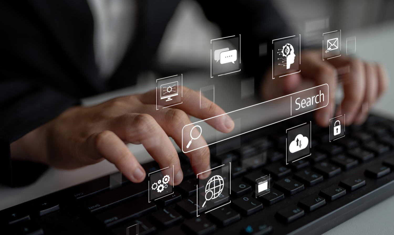 Fingers typing on a keyboard to search